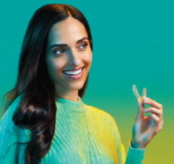 Woman holding suresmile clear aligners